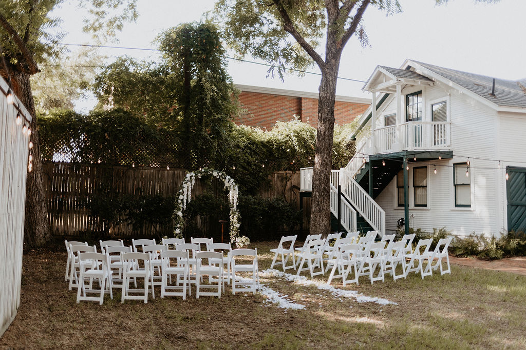 Micro wedding ceremony setup in a backyard of a historic home