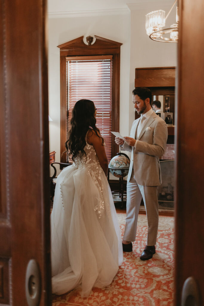 Bride and groom reading private vows