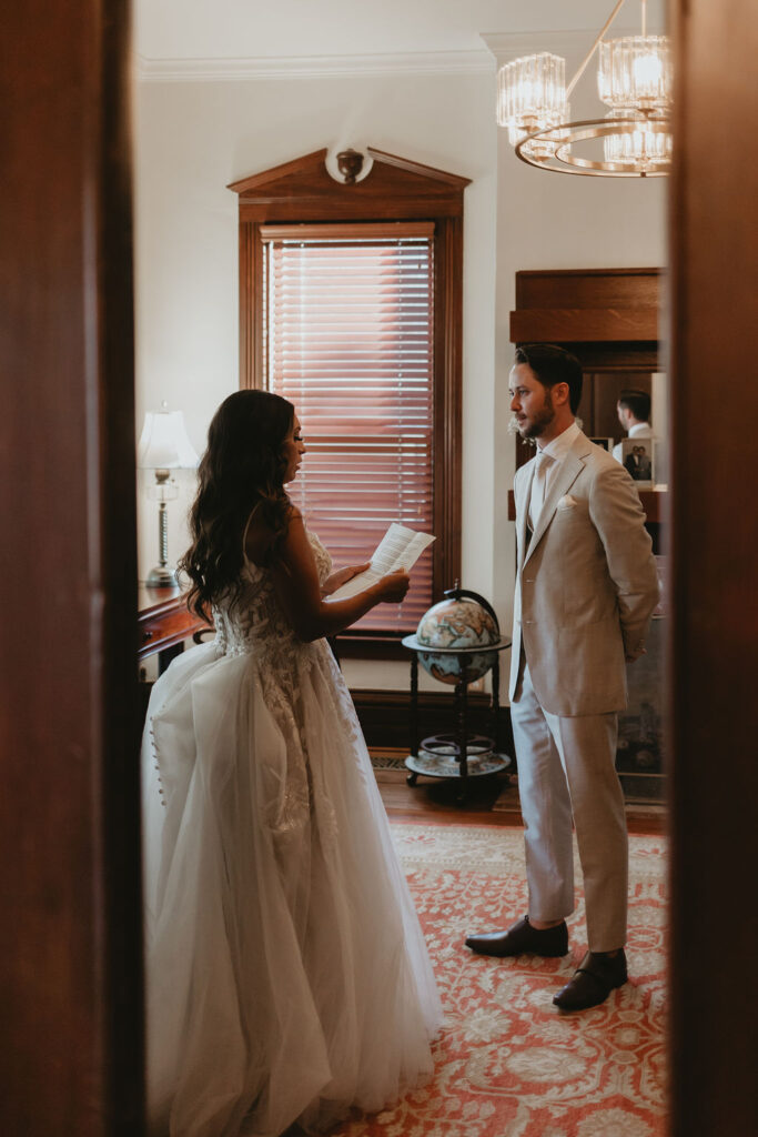 Bride and groom reading private vows