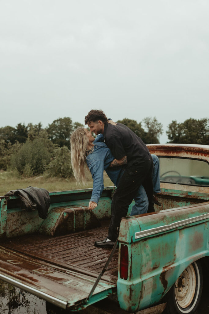 Couples dances in the back of a vintage truck during their couples session