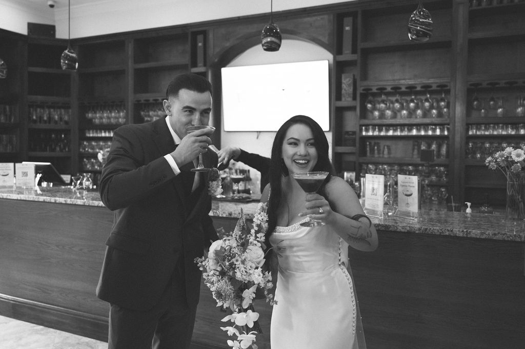 Bride and groom drinking an espresso martini together