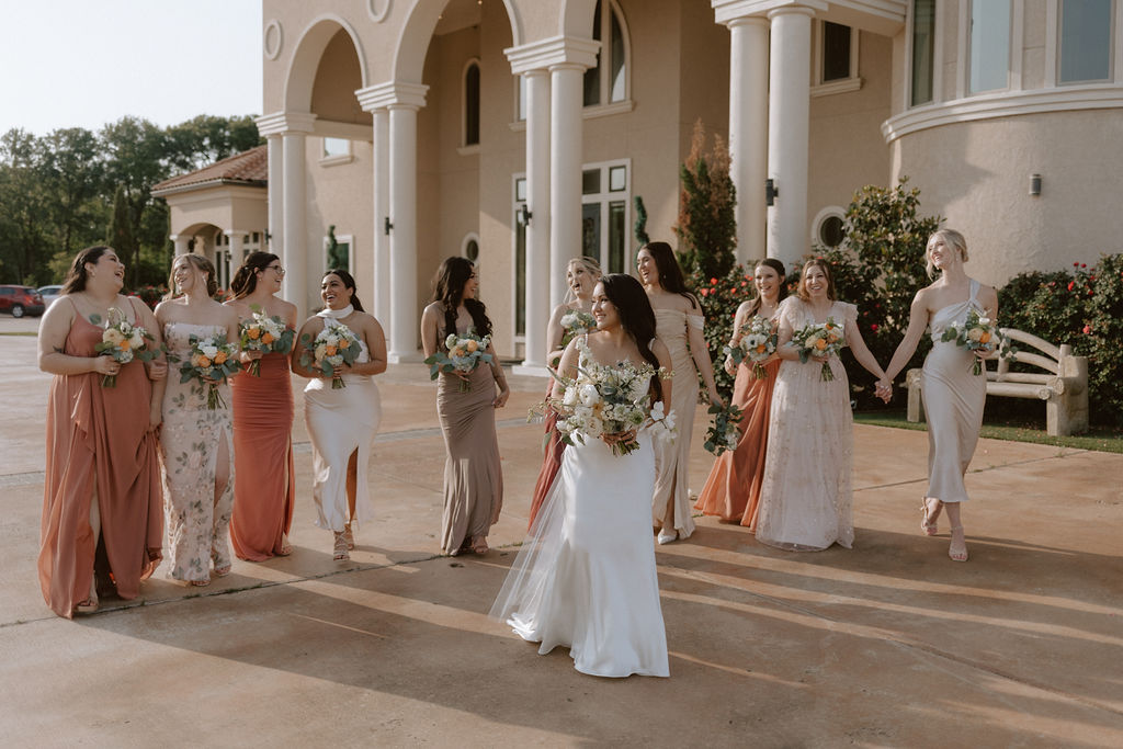 Bride walking with bridesmaids