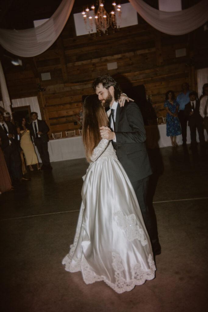 Bride and groom dancing at wedding reception