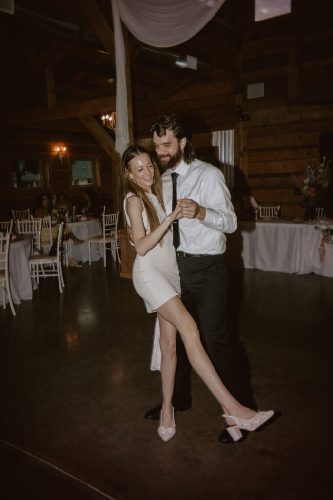 Bride and groom dancing at wedding reception