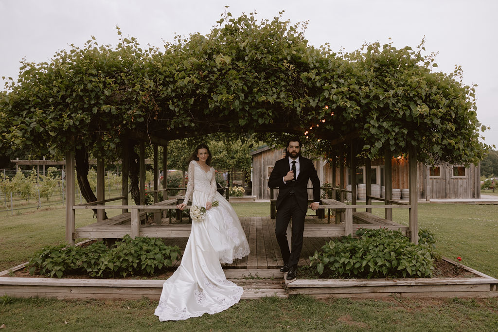 Bride and groom sitting outside of their wedding venue in Oklahoma