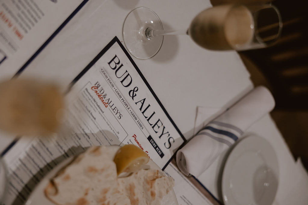 Bride and groom have dinner with their guest at Bud and Alley's in Florida