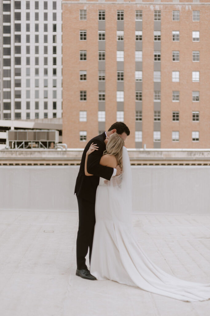 Bride and groom wedding portraits on a rooftop in Dallas, Texas