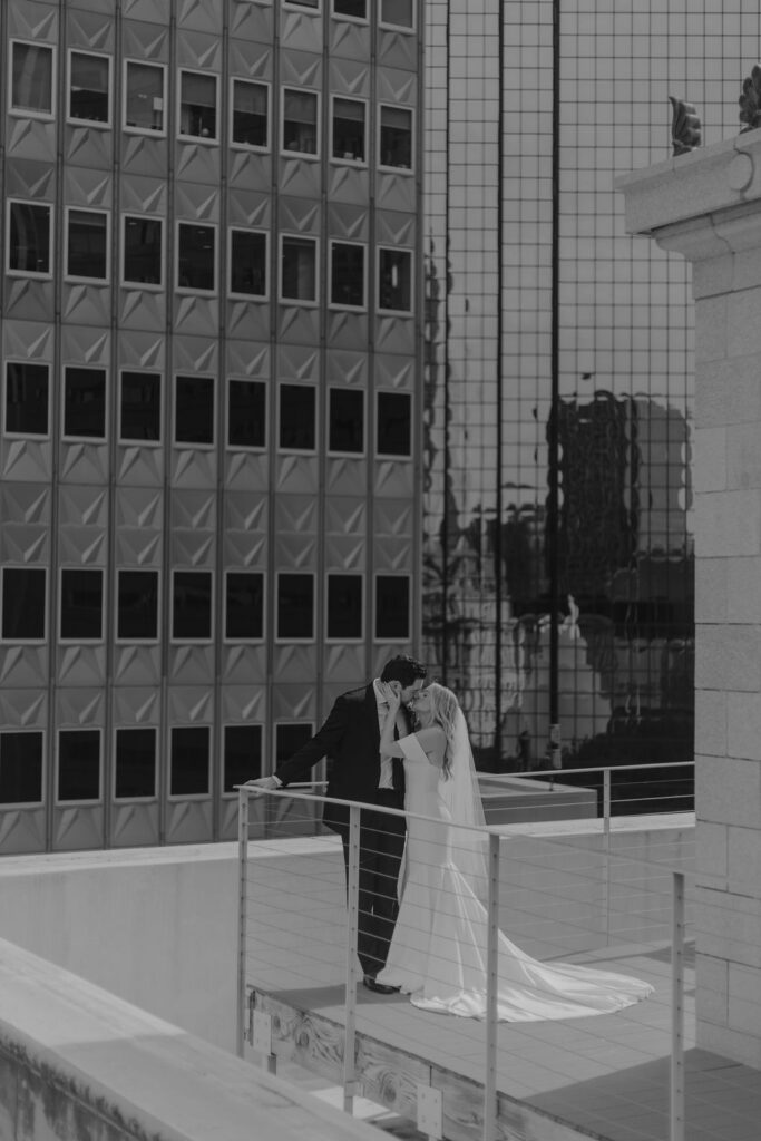 Bride and groom wedding portraits on a rooftop in Dallas, Texas