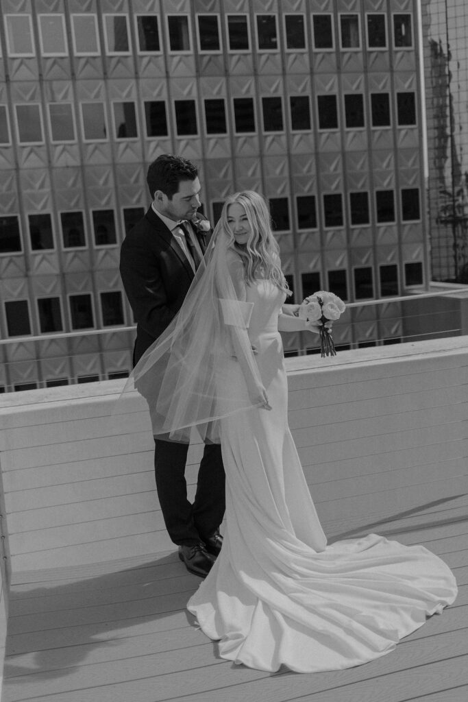 Bride and groom wedding portraits on a rooftop in Dallas, Texas