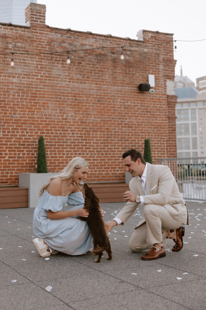 Man surprises woman with their dog at their proposal