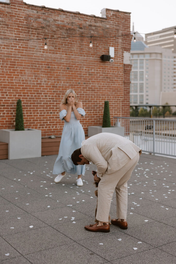 Man surprises woman with their dog at their proposal