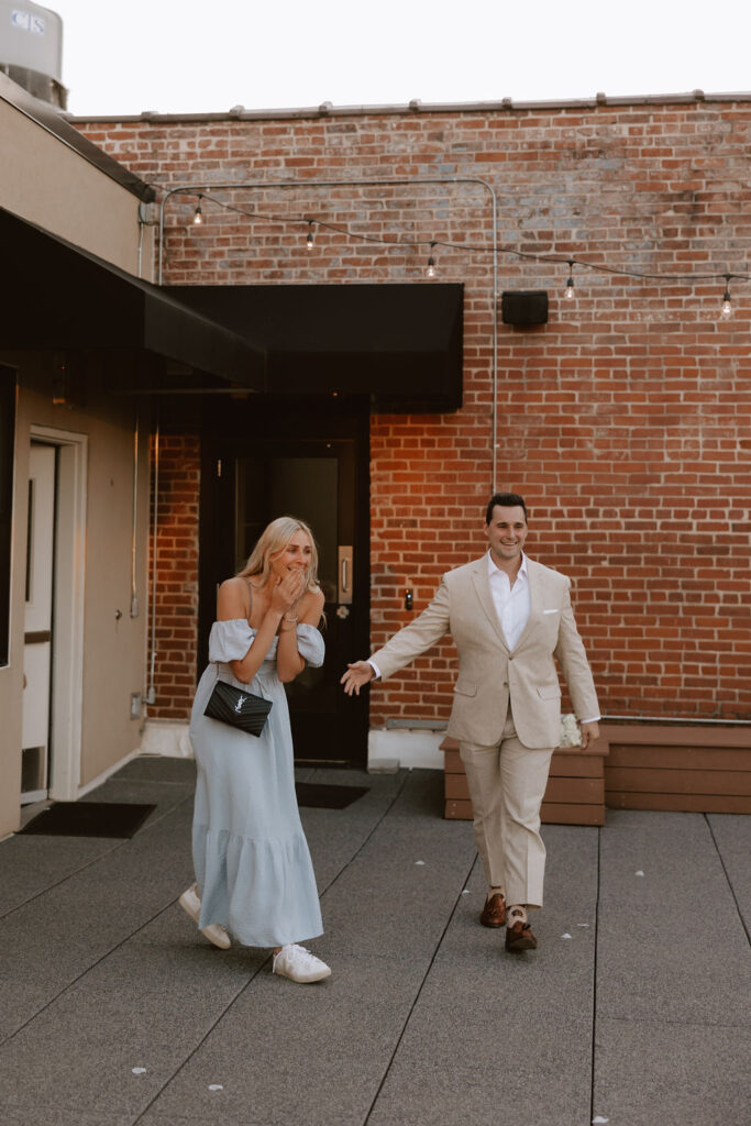 Woman walks into a surprise rooftop proposal in OKC