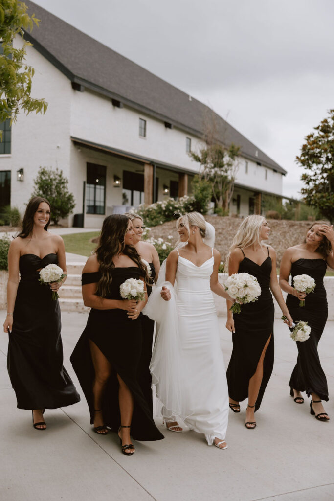 Bride walks with bridesmaids