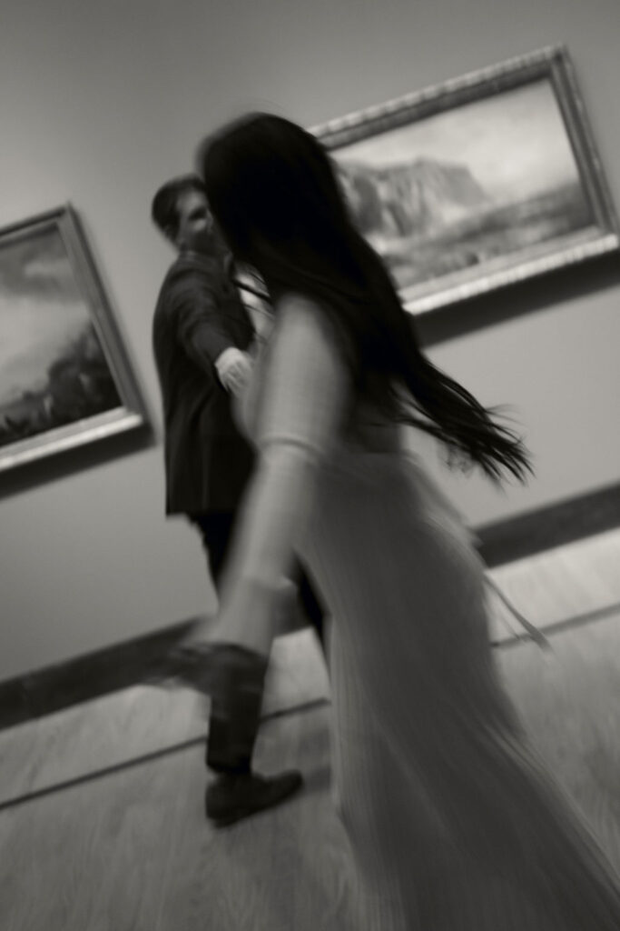 Moody engagement photos at a museum