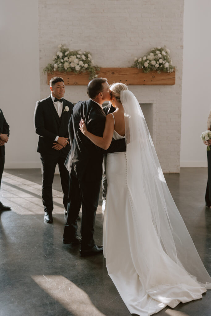 Documentary photography of bride and father at the altar