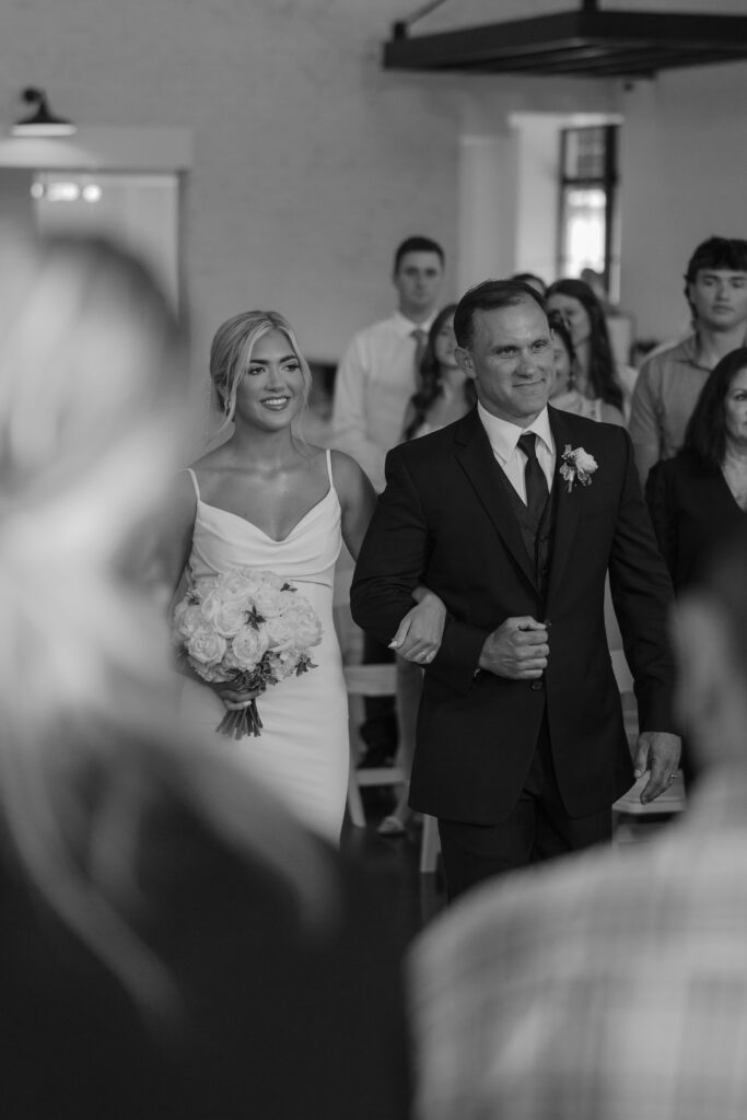 Documentary photography of bride and father walking down the aisle