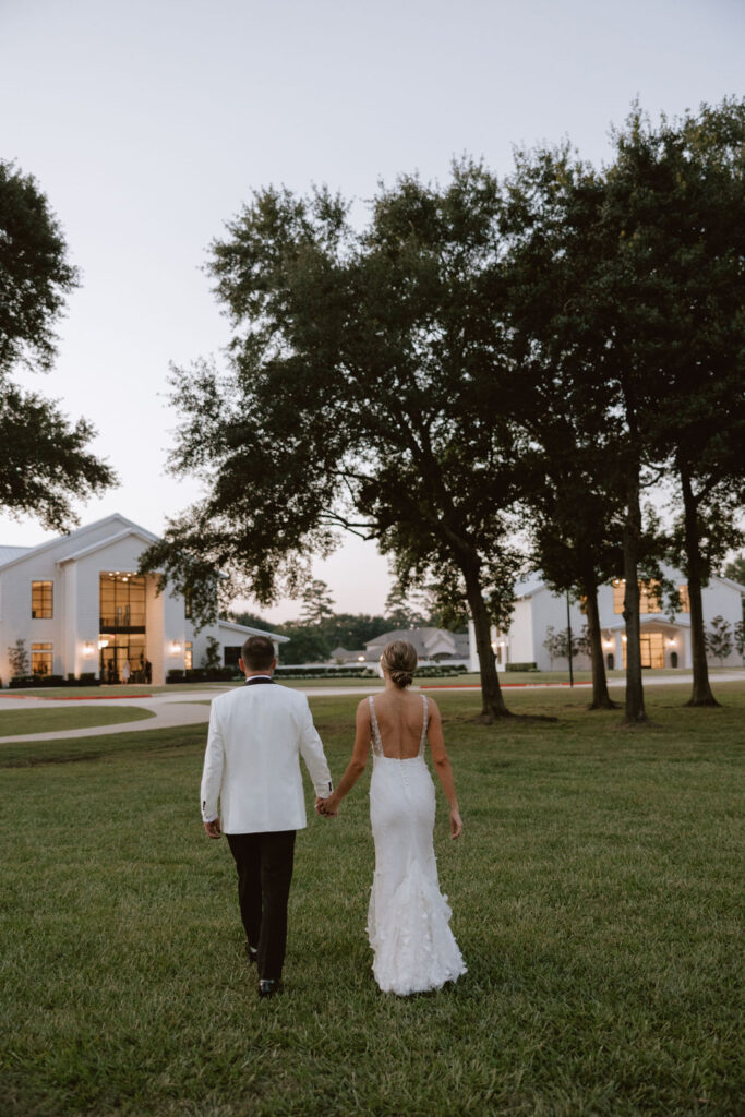 Bride and groom take portraits outside of Boxwood Manor