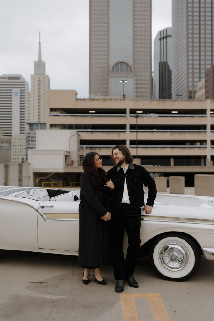 Rooftop engagement photos with the downtown dallas city skyline in the backdrop