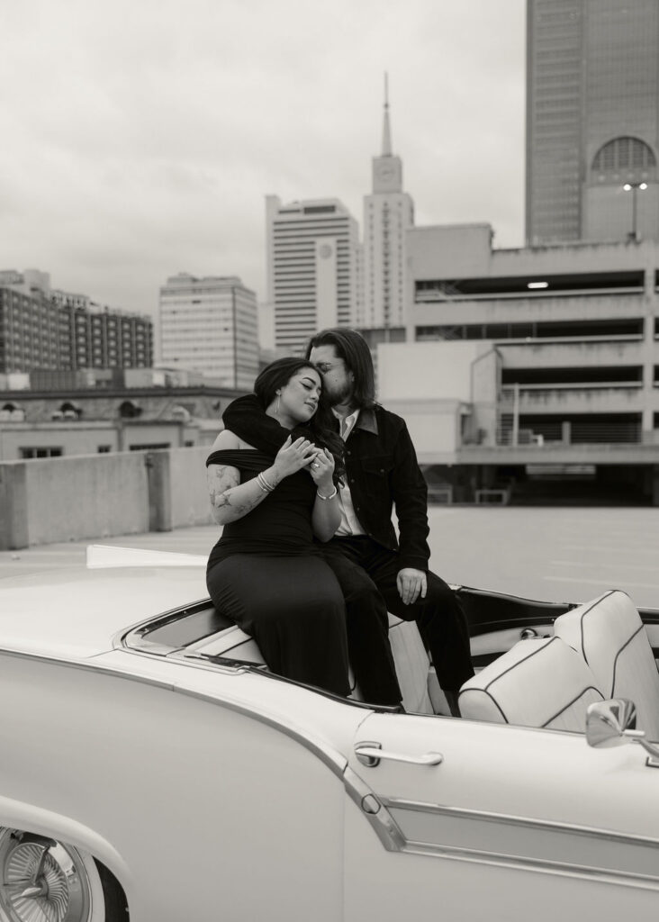 Rooftop engagement photos with the downtown dallas city skyline in the backdrop