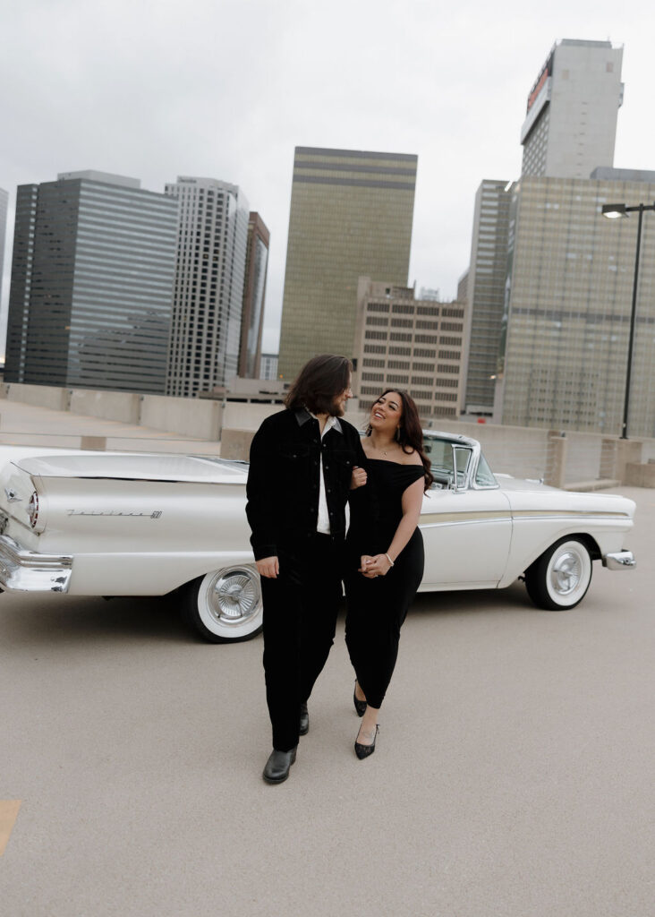 Rooftop engagement photos with the downtown dallas city skyline in the backdrop