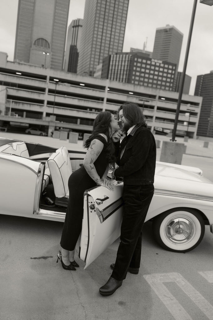 Rooftop engagement photos with the downtown dallas city skyline in the backdrop