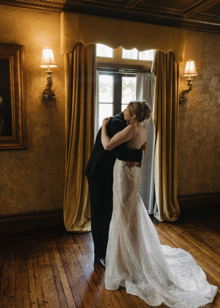 Bride and groom first look inside Dresser Mansion