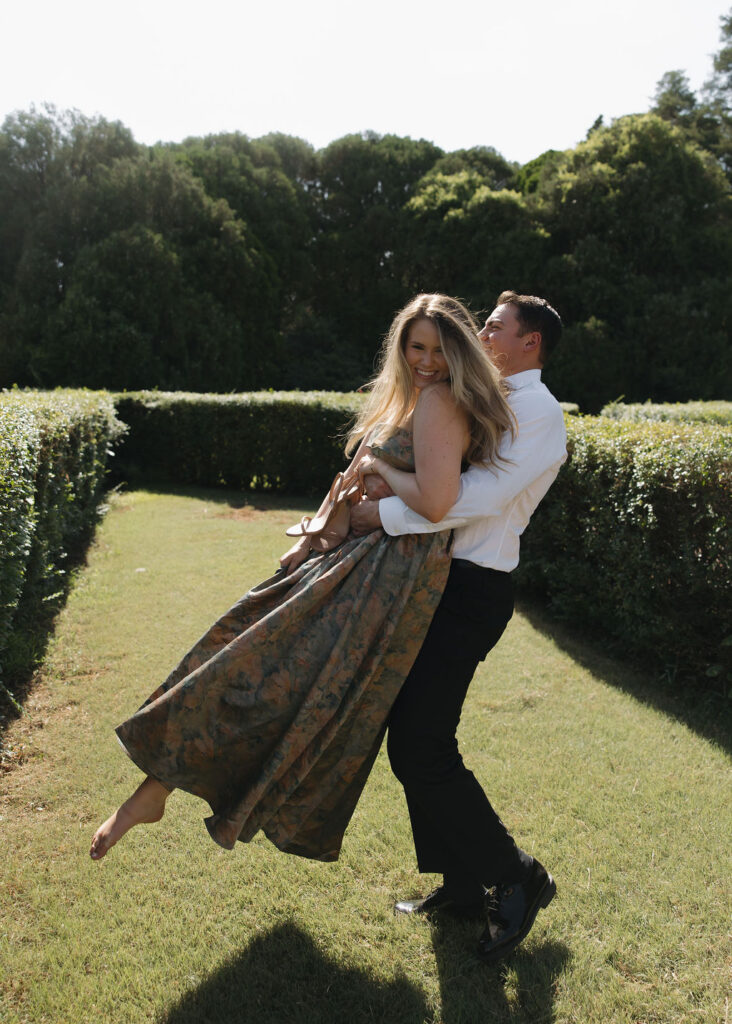 Playful engagement photos in the gardens outside Marland Mansion in Oklahoma