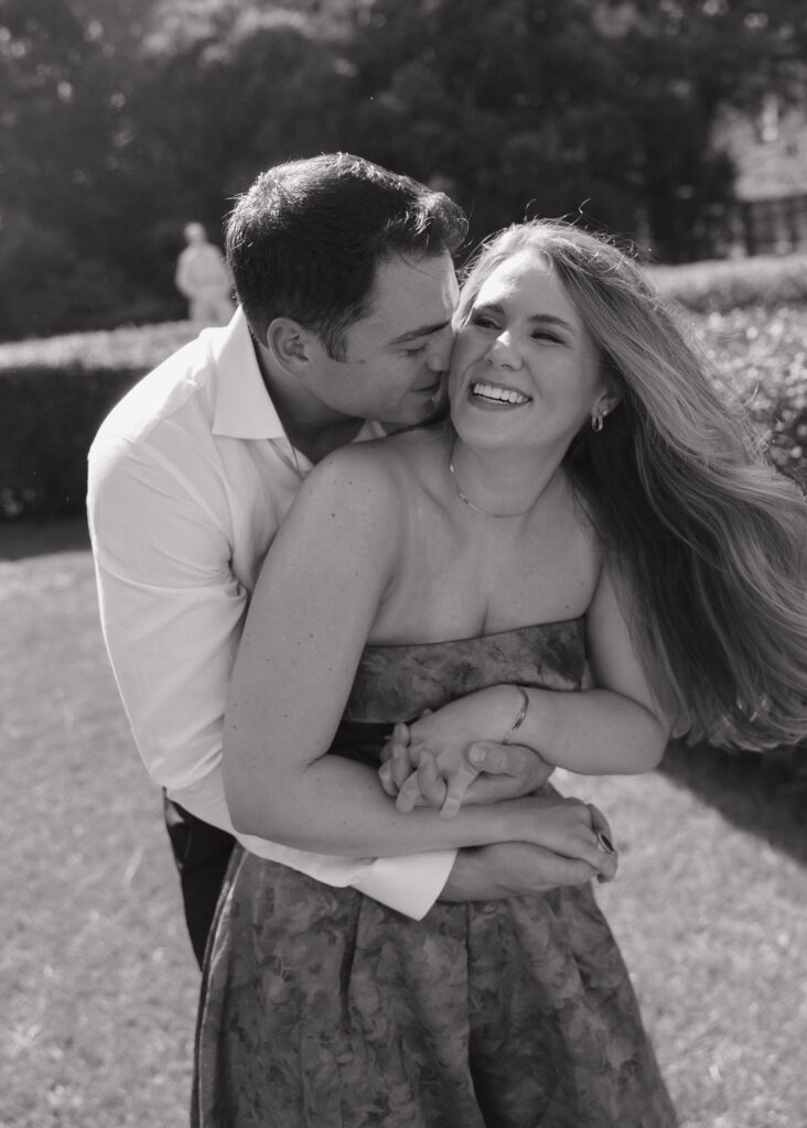 Playful engagement photos in the gardens outside Marland Mansion in Oklahoma