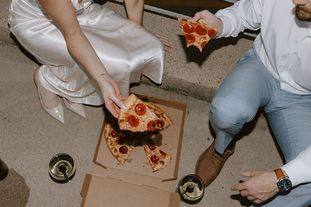 Rooftop engagement photos with pizza in downtown Dallas