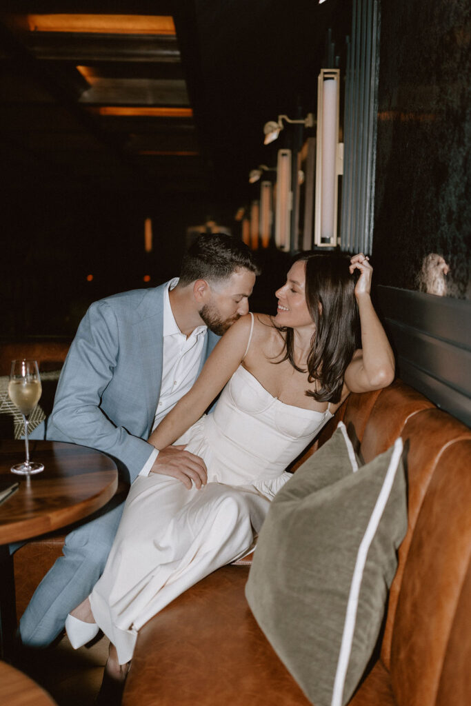 Moody, romantic engagement photos in Dallas at a speakeasy