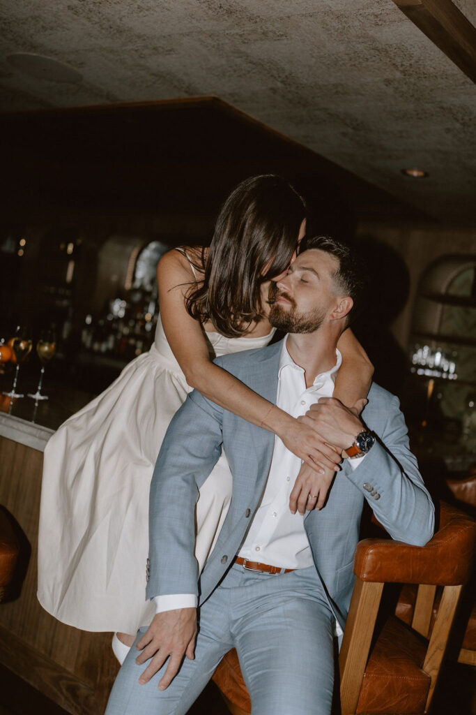 Moody, romantic engagement photos in Dallas at a speakeasy