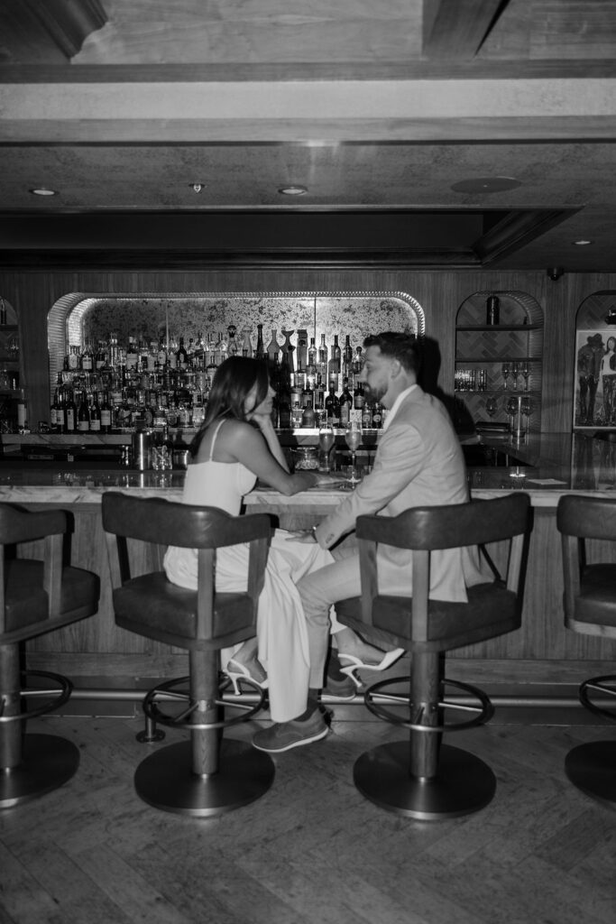 Moody, romantic engagement photos in Dallas at a speakeasy