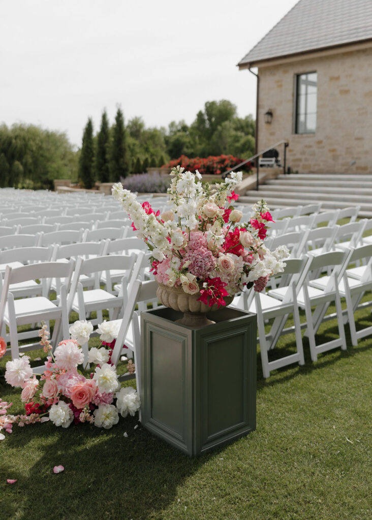 Pink wedding ceremony floral installations
