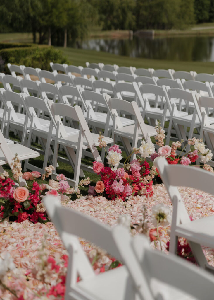 Pink wedding ceremony floral installations