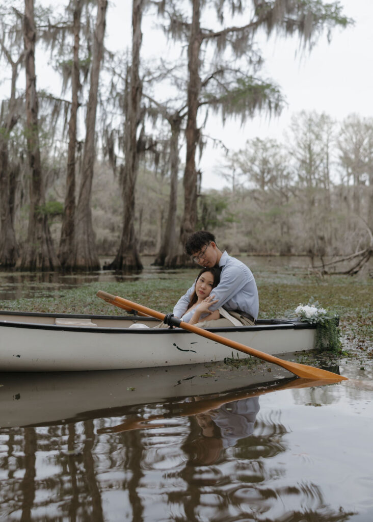 Moody lake engagement photos in Texas with moss covered cypress trees in the backdrop