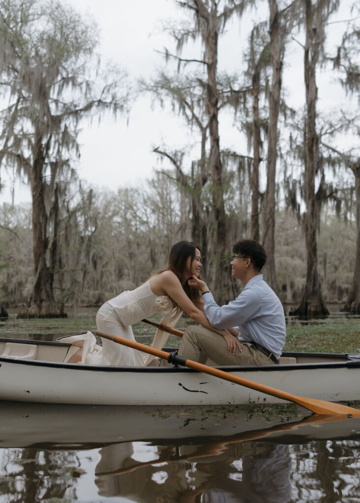 Moody lake engagement photos in Texas with moss covered cypress trees in the backdrop