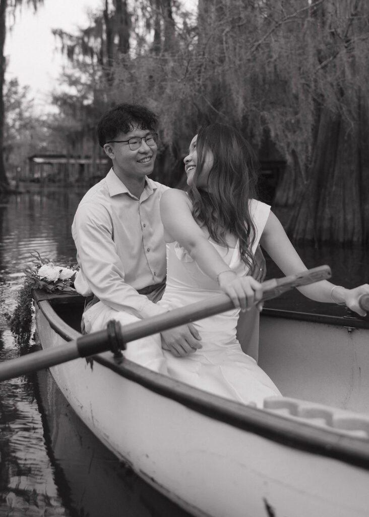 Couple rides in a canoe through Caddo Lake